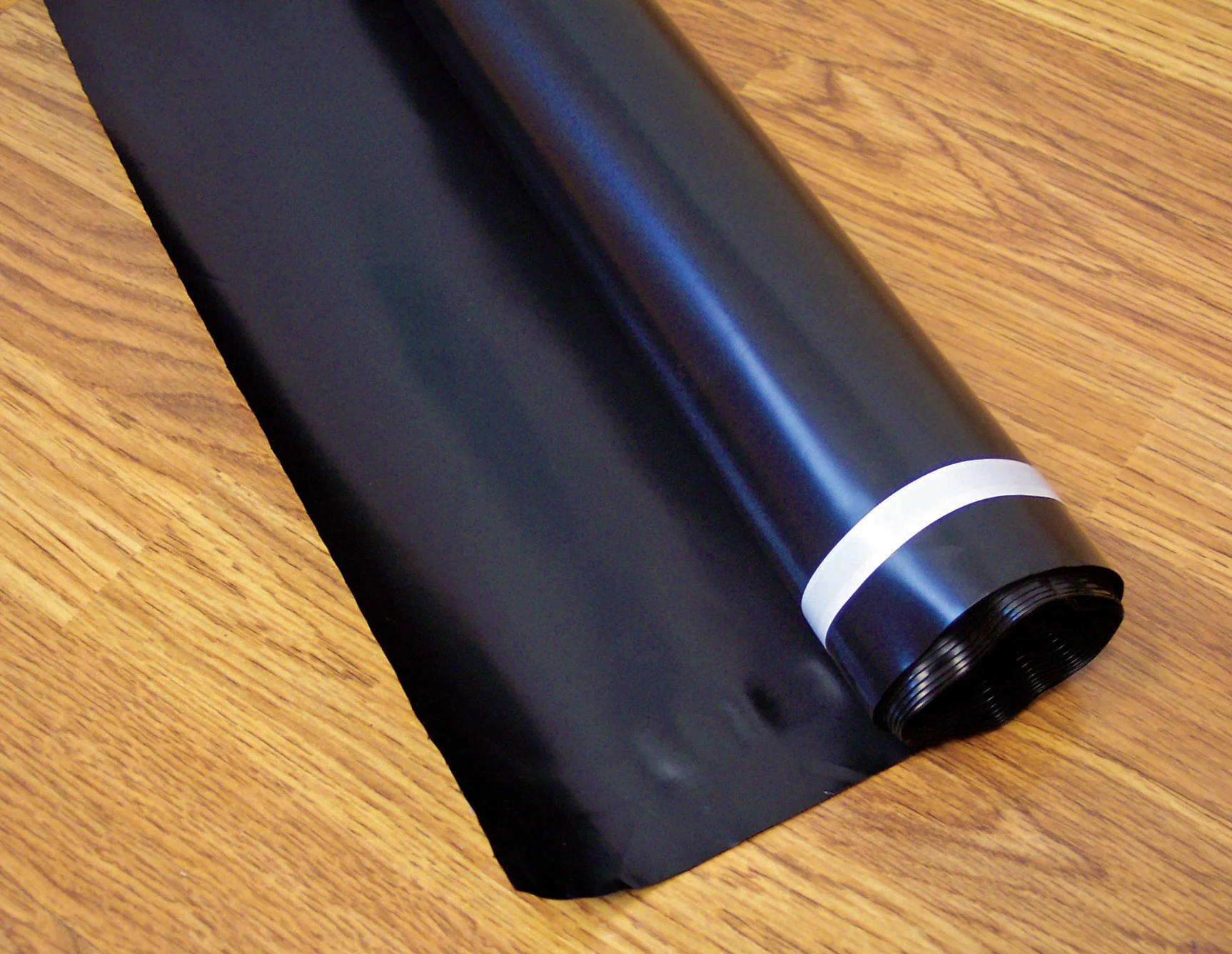 How far up the edge of the wall do I go with the black vapor barrier?